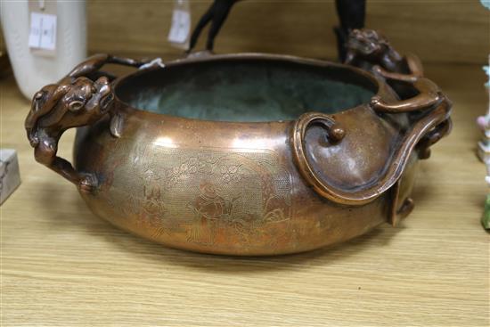 A large Chinese bronze dragon censer, Xuande mark length 38cm